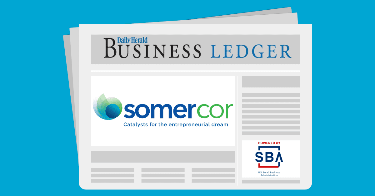 A newspaper with the business ledger logo on it.