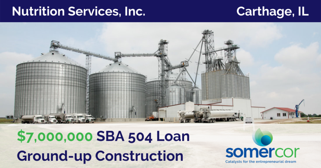 A picture of a grain silo with the words " sba 5 0 4 loan group construction ".