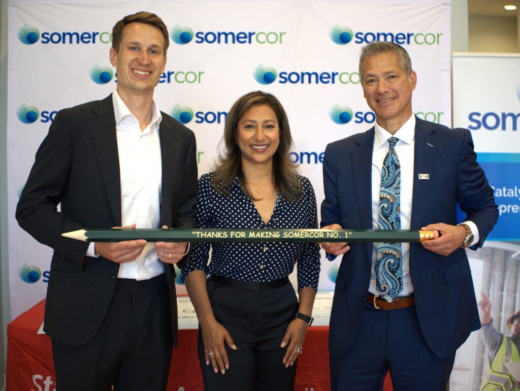 (Left to right) Eric Bacon, Angelica Garcilazo, Manny Flores holding a Big Green Pencil