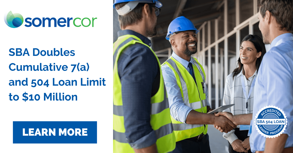 Construction professionals shaking hands at job site